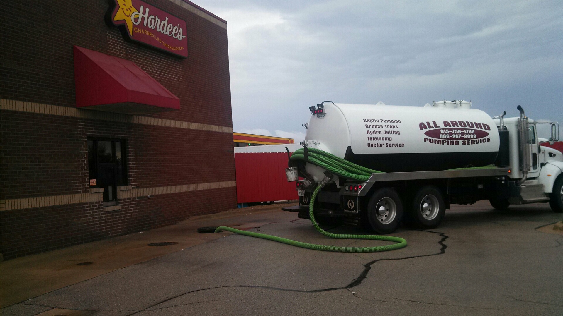 Cleaning Hardees Restaurant Grease Trap